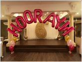 Colorful latex balloon arch with custom mylar name letters centerpiece